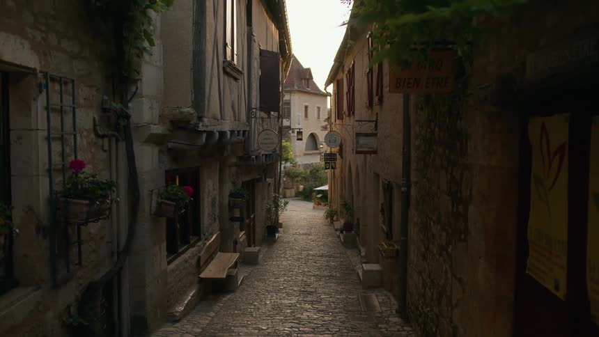 The alley is paved with cobblestone