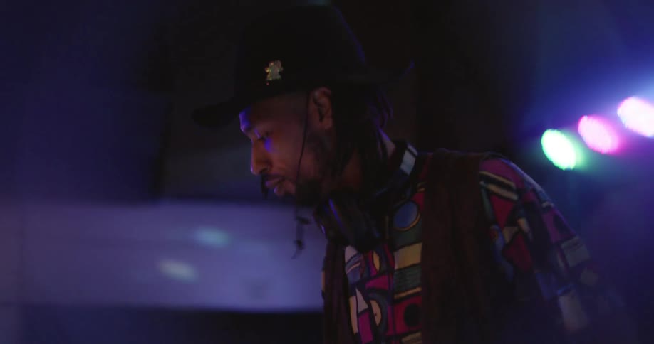Male dj attending a party in a club