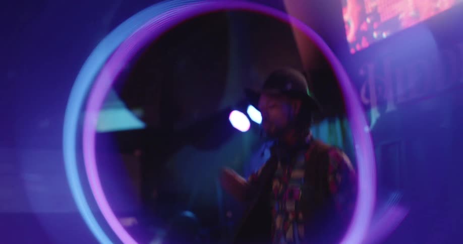 The dj dances as he plays music