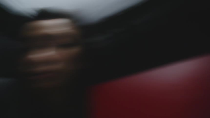 Woman sitting in an indoor space