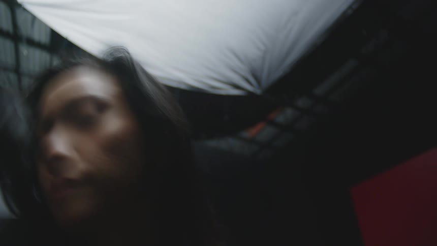 A blurred clip of an asian lady