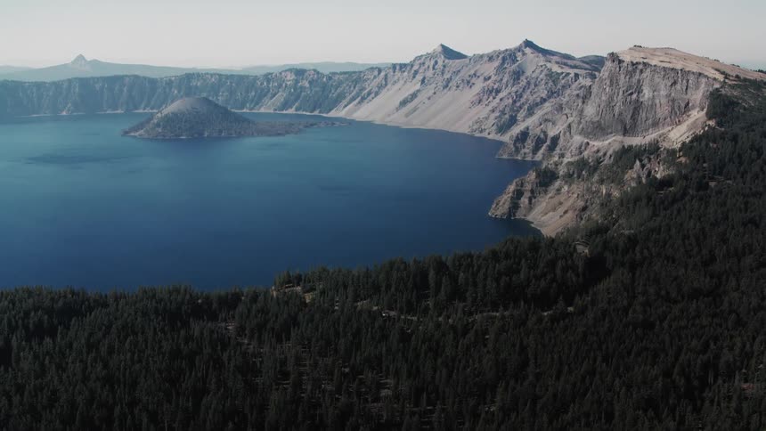 A large forest and mountain surround the lake