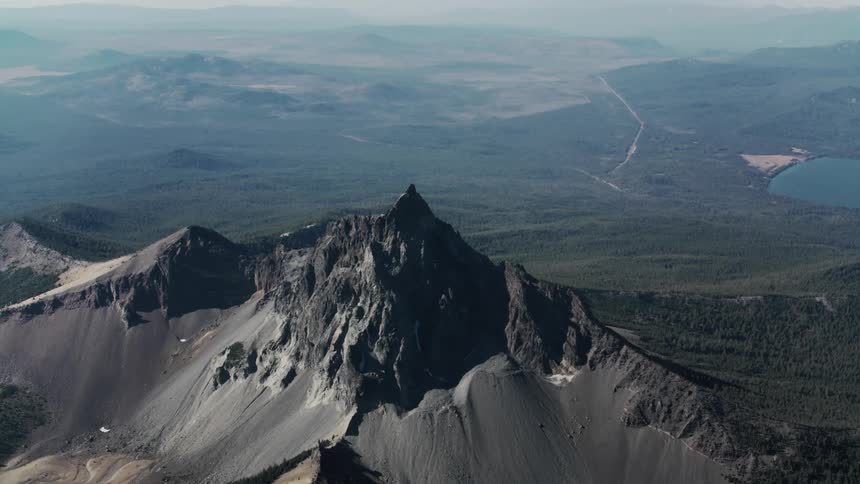 Aerial panorama of a mountain with steep cliffs in a valley