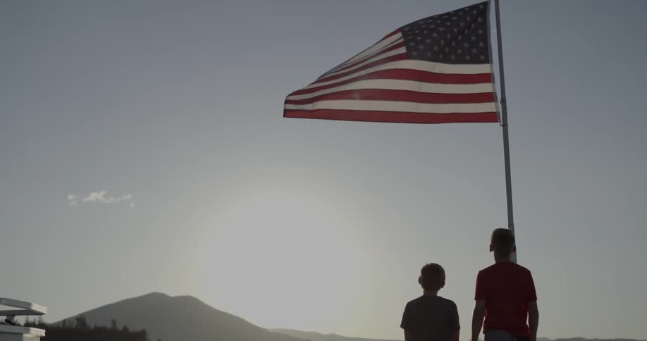 People standing by an american flag