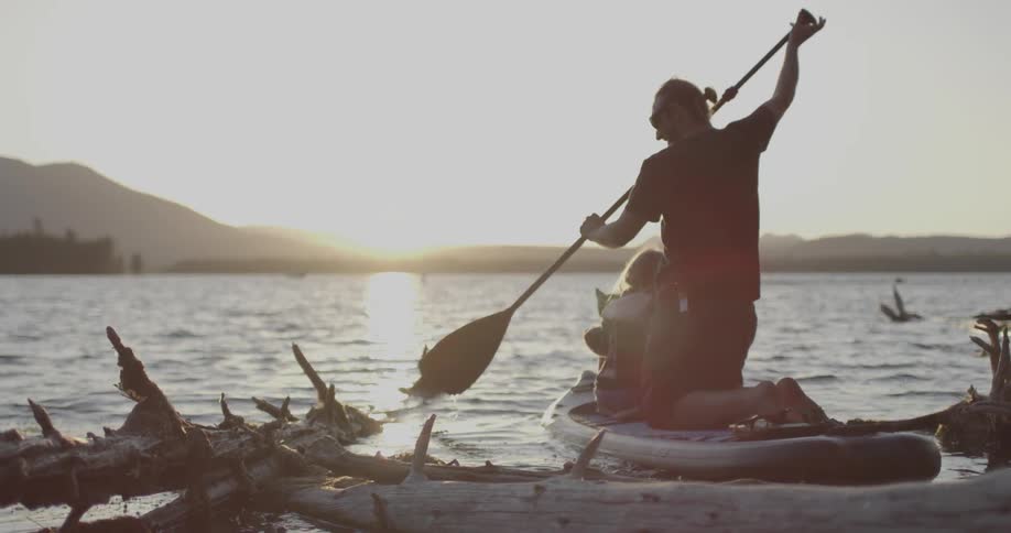 Man paddles a kayak into the water