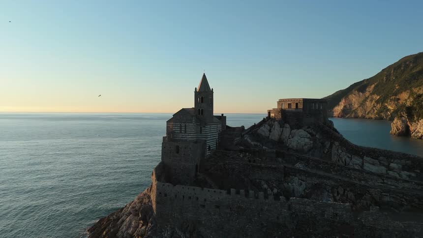 A church is on the shore line of the island