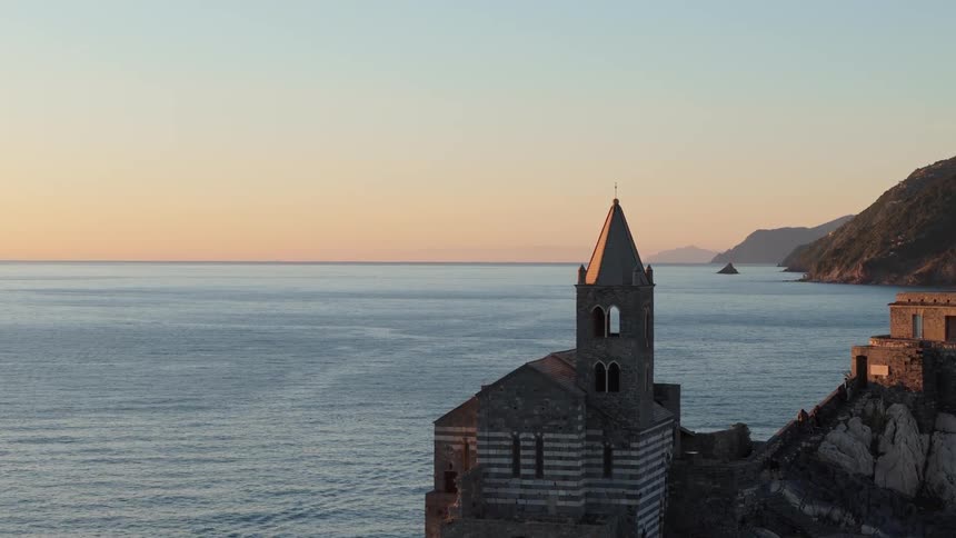 A camera pans over a castle to reveal the horizon
