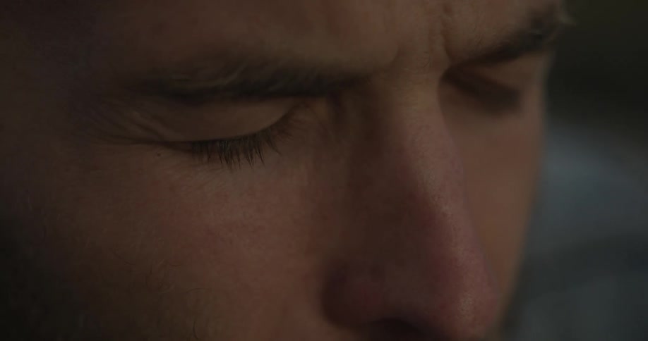 Man keeps his eyes closed