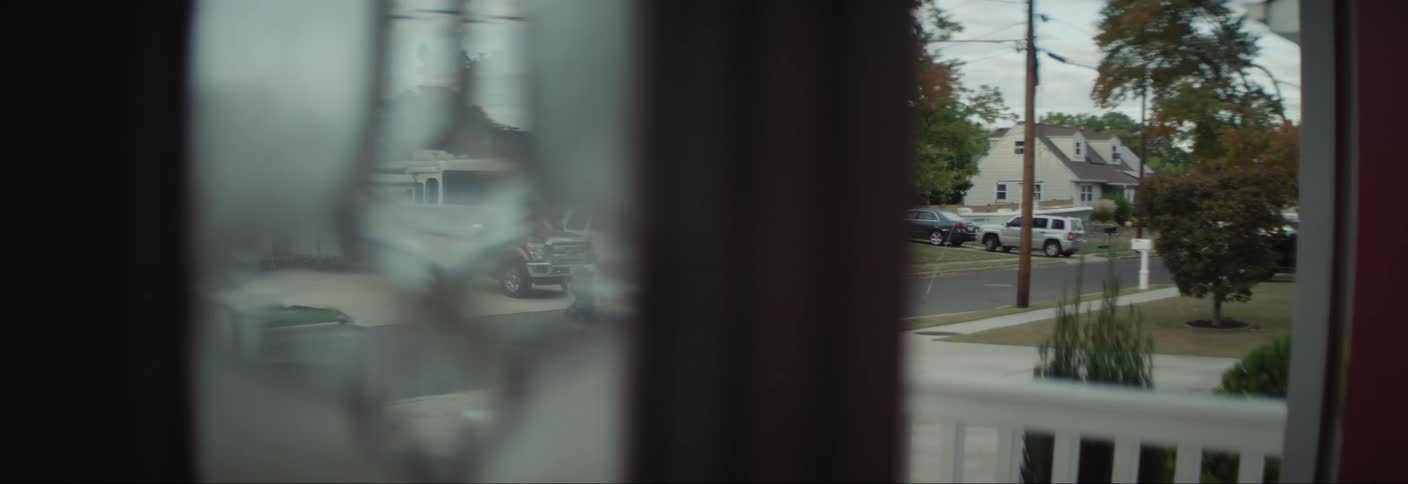 Two children running after knocking on the door