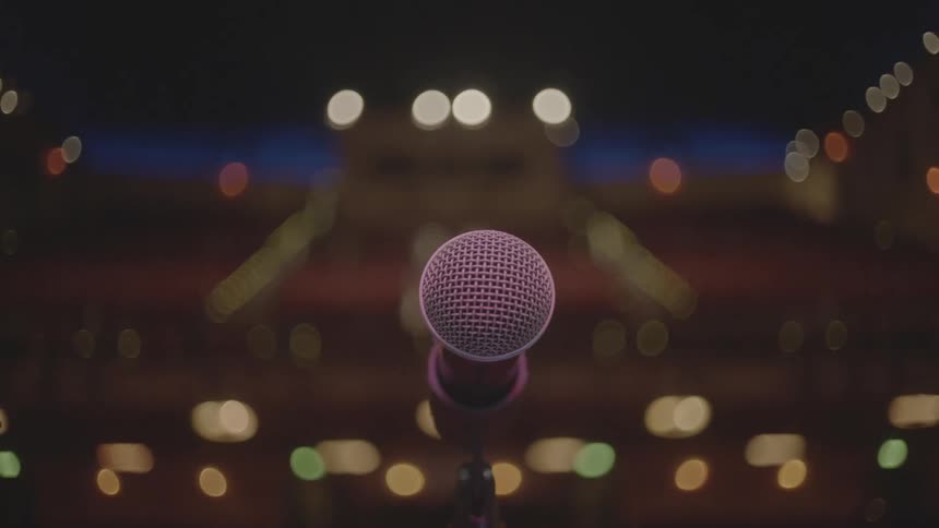 A microphone center stage looking out to the crowd