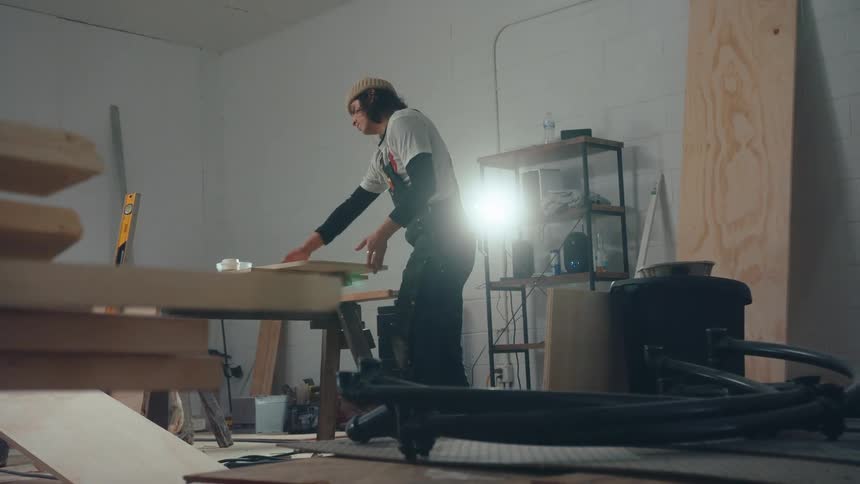Carpenter in caps working in an indoor space