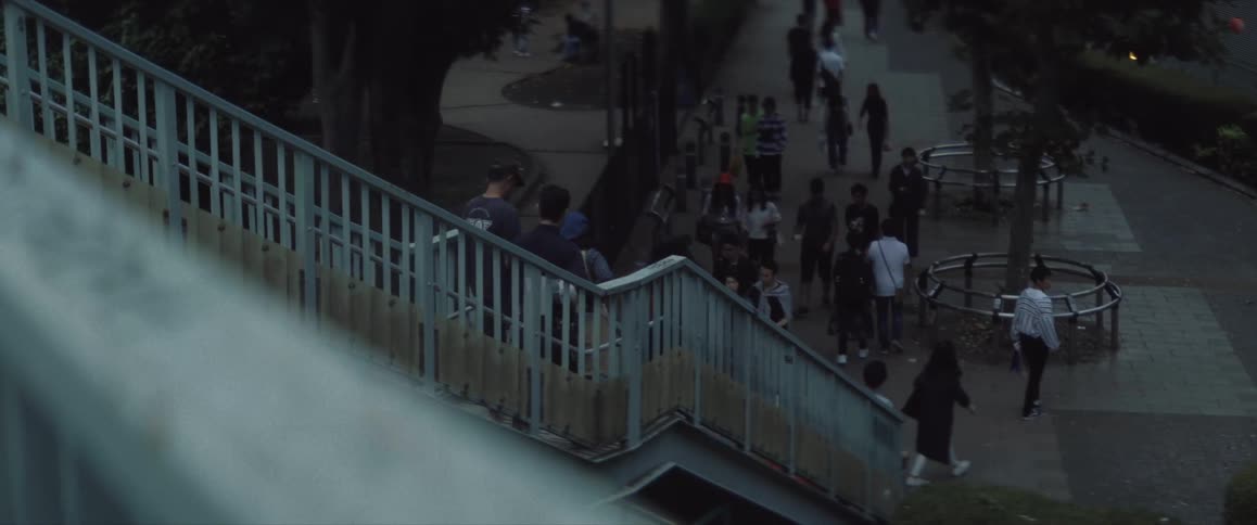 Pedestrians walking up and down stairs in the city