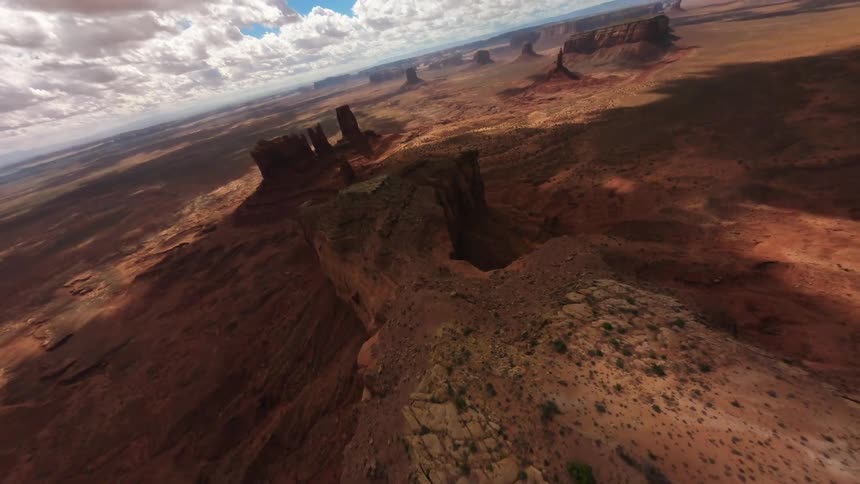 Aerial panorama of a large natural area with canyons