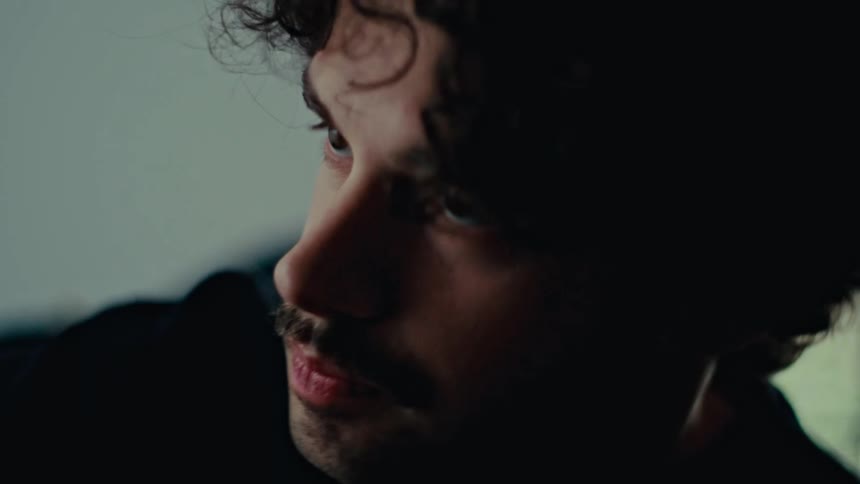 Portrait of a curly haired man