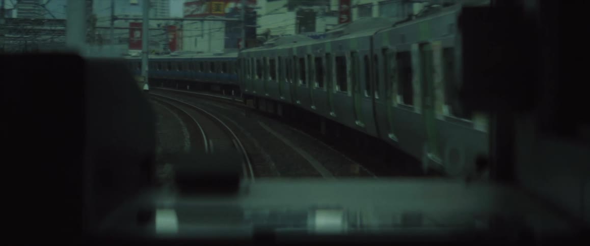 Front view of a Tokyo Subway train and another train coming towards it