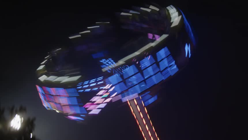 Illuminated toy in operation at night in a park