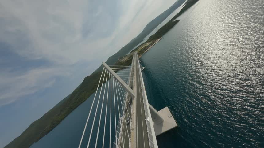Aerial view of a long bridge over the sea