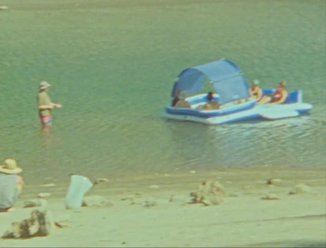 People on a float in a lake enjoying a summer moment