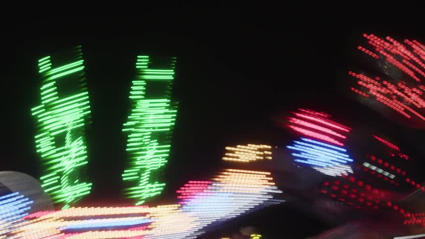 Toy with rotating lights in an amusement park at night