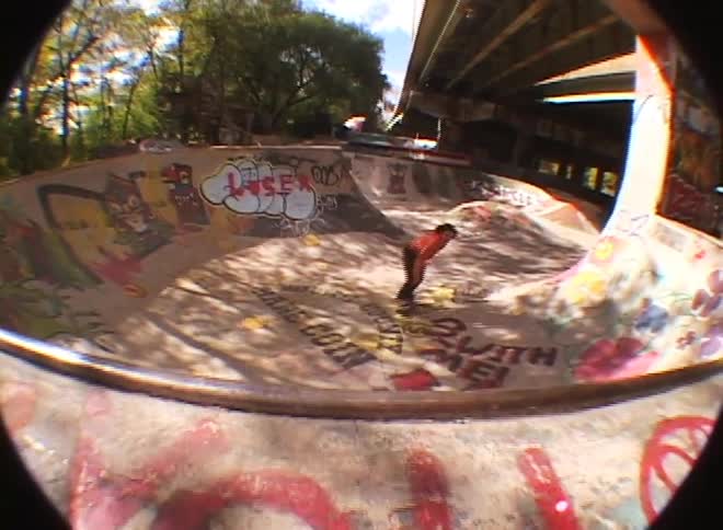 Person doing skateboard tricks on a track