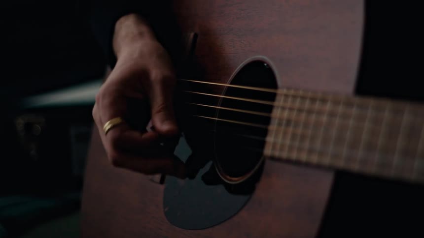 Hand of a person playing guitar