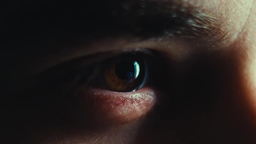 Close up of a persons eye blnking