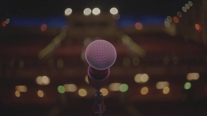 Close up of a microphone in an auditorium