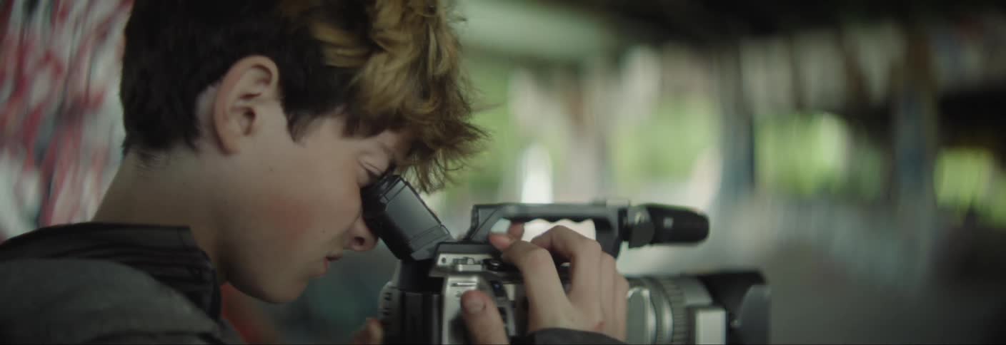 Boy using a professional camera