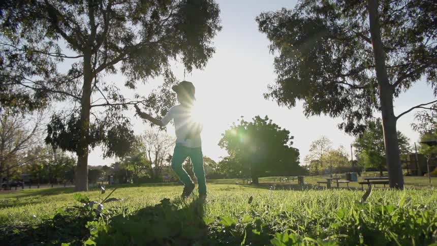 A child runs through a park