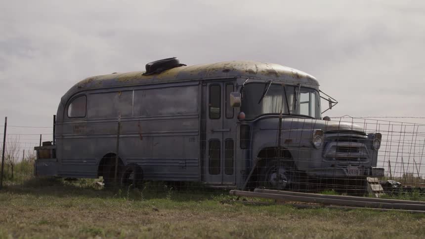 View of a broken down old school bus