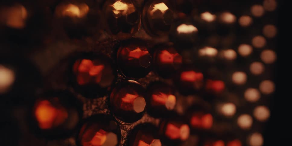 Closeup of several shiny stones with light reflection
