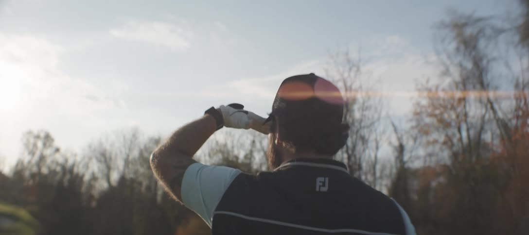 Man looking at the horizon on a golf course