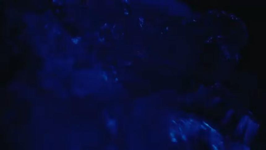 Abstract light flashing on a mineral