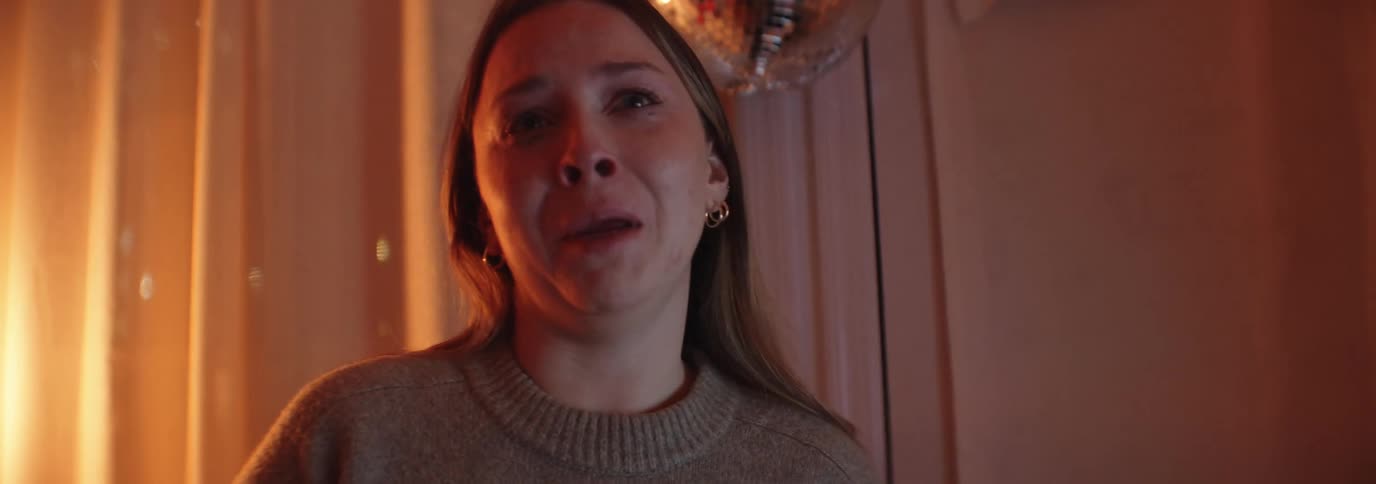 Portrait of a woman talking and crying at the same time