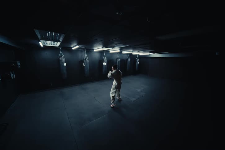 Woman indoors training boxing punches