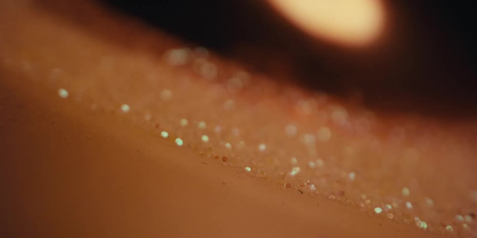 Glowing lamp bobs over a surface covered in ice at night