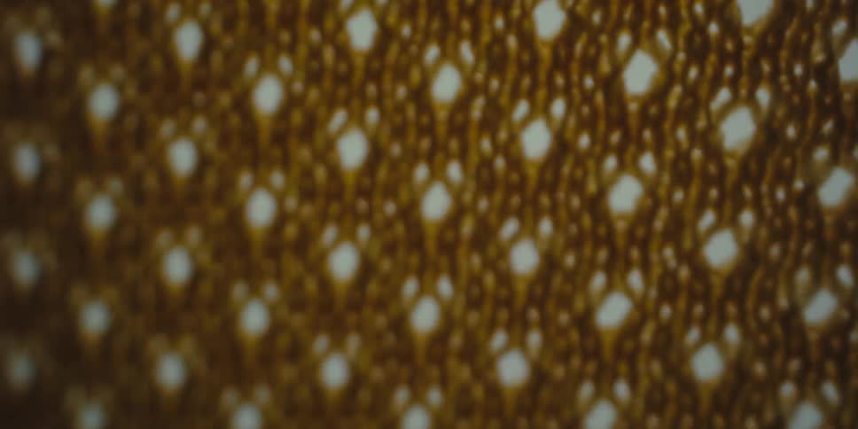 Close up of an abstract texture with yellow and red light