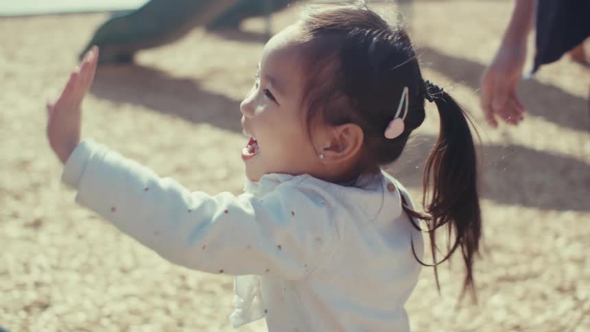 A clip of a girl playing at a park