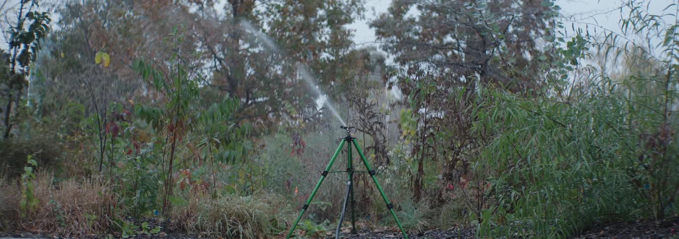 Water system irrigating an outdoor green area