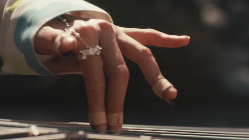 Closeup of hands playing a musical instrument