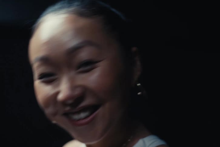 A woman smiles and laughs