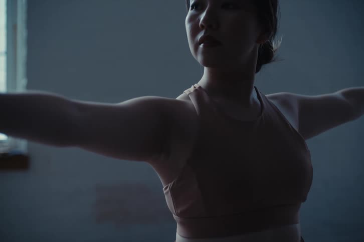 A clip of an asian lady stretching