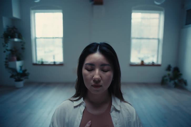 A woman slowly opens her eyes
