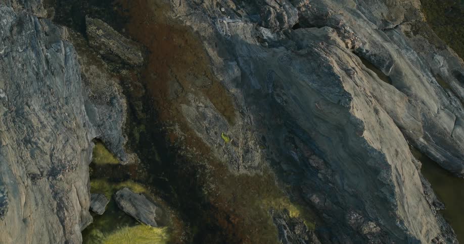 Aerial of a river bordered by ridges in mountainous terrain