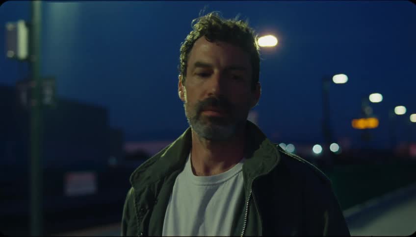 Portrait of a bearded man outdoors at night