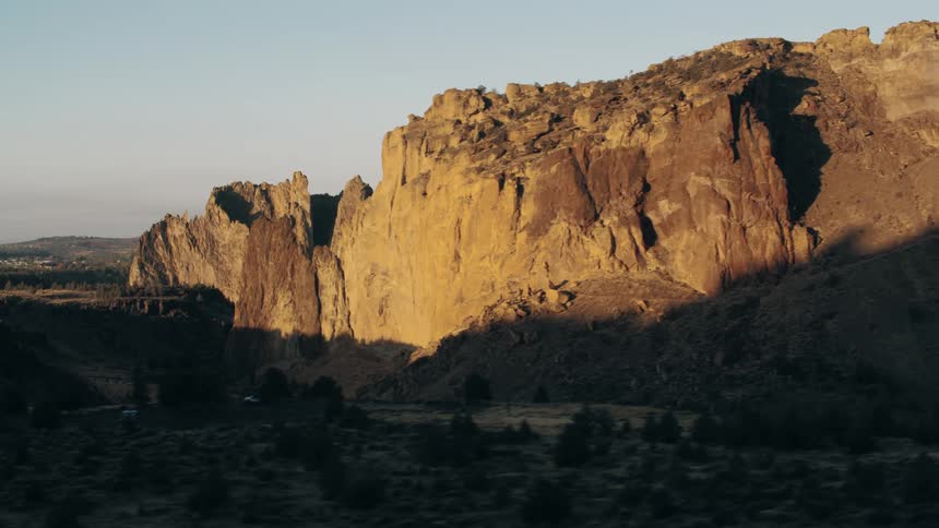 Aerial view of a canyon in an area with sparse desert vegetation