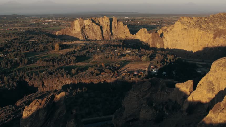 An aerial view of a large canyon where a town is settled