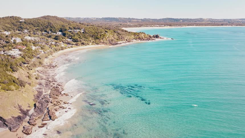 The ocean washes up along the coast