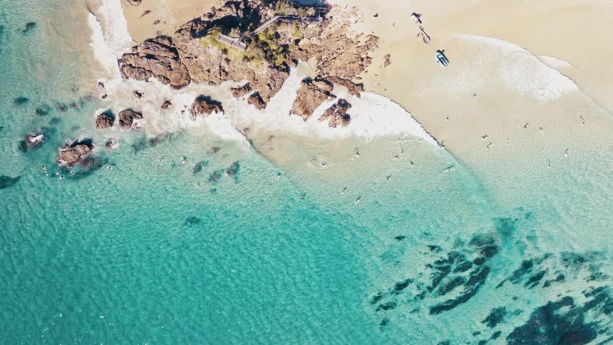 Blue water is on the beach