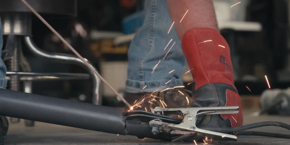 A man is welding with a torch